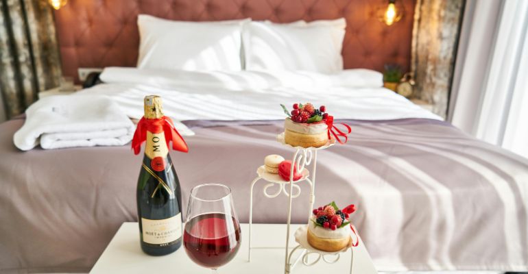 Bedroom in a hotel with champagne on arrival